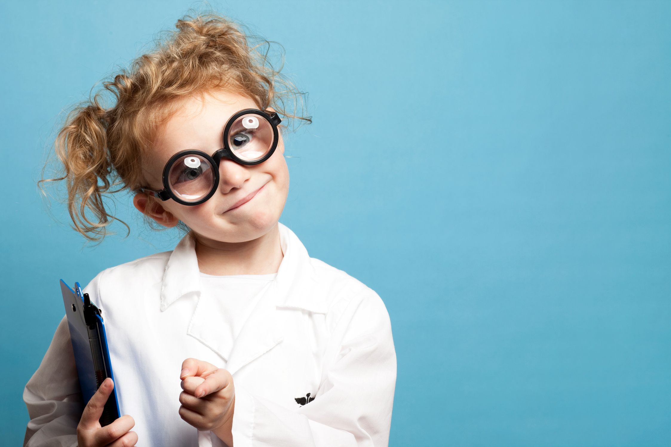 Smiling Child Doctor with Clipboard